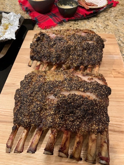 Seasoned rack of ribs on a cutting board