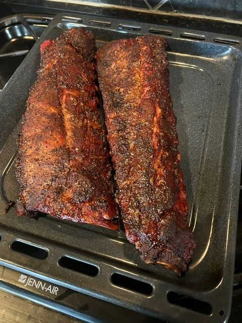 Ribs coated with Monty's Backyard Legend BBQ Rub
